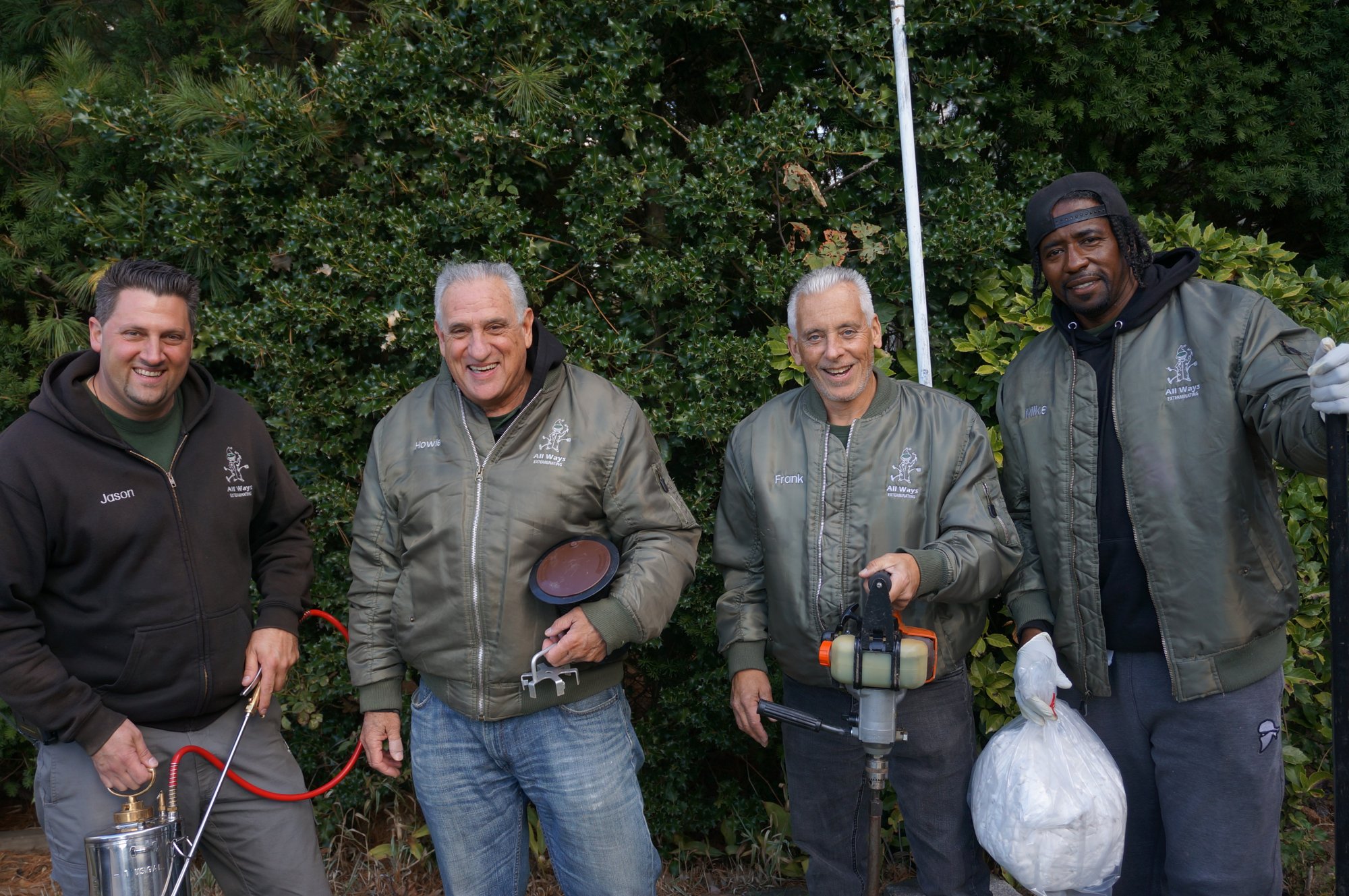 The All Ways Exterminating crew in branded jackets, Lynbrook NY